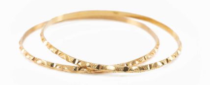 PAIR OF YELLOW METAL CLOSED BANGLES, 16.8gms gross (2) Provenance: deceased estate Neath Port Talbot