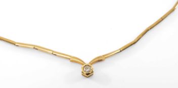 YELLOW METAL DIAMOND SET NECKLACE, the single stone (0.2cts approx.) in rub over setting, 40cms