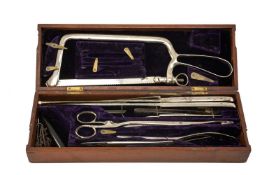 19TH C. BOXED FIELD SURGICAL INSTRUMENT SET, including Evans & Wormall stamped bone saw, Evans & Co,