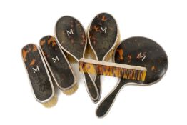 GEORGE V SILVER & TORTOISESHELL VANITY SET comprising mirror, four brushes and comb, baring the