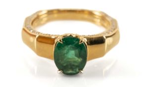KAT FLORENCE 18K EMERALD & DIAMOND RING, oval cut stone above diamond girdle and diamond edge-
