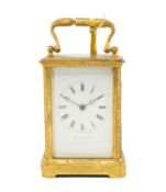 LATE 19TH C. GILT BRASS CARRIAGE CLOCK, retailed by Howell James, white enamel dial with black Roman