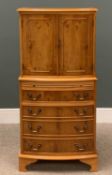 MODERN YEW EFFECT DRINKS CABINET, bow fronted, upper section with mirrored interior, central