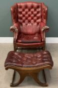 ANTIQUE WING BACK ARMCHAIR & STOOL, upholstered in red leather, with button and studded back and