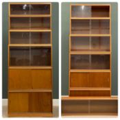 TWO SIMPLEX MID-CENTURY TEAK STACKING BOOKCASES, each of six levels, with sliding glass and wooden
