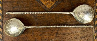 PAIR OF RUSSIAN SILVER GILT TWIST STEM SPOONS, the bowls chased to the reverse stamped '84' with '