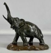 PAINTED SPELTER FIGURE OF TRUMPETING ELEPHANT on hardwood stand, 27cms (h) Provenance: private