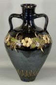 LARGE STUDIO TERRACOTTA TWO-HANDLED AMPHORA VASE, black glazed and painted with a band of flowers,