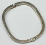 CLOGAU WELSH SILVER 'CARIAD' HINGED BANGLE of rounded rectangular form, with rose gold clasp, 60 x