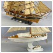 PAINTED WOODEN MODEL OF SAILING BOAT with single mast, on stand, 78cms (h) with wooden model of