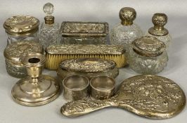 ASSORTED SILVERWARE including dressing table jars and bottles with silver mounts, two napkin