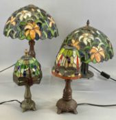 FOUR TIFFANY STYLE TABLE LAMPS with leaded shades, 40cms (h) the tallest Provenance: private