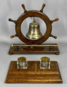 EDWARDIAN OAK SHIPS WHEEL GONG, on rectangular stand with brass bell and nickel striker, 30cms (h)
