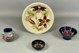 MOORCROFT POTTERY, four pieces, cream 'Fuchsia' circular shallow dish, monogrammed 'WM', 21.5cms (