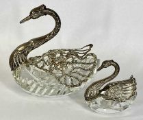 TWO GOOD QUALITY CUT GLASS SWANS with silver heads, necks and spreading pierced wings, marked 925,