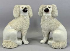 PAIR OF 19TH CENTURY STAFFORDSHIRE POODLES, modelled seated with open front legs, textured ears,