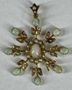 VICTORIAN 9CT GOLD STAR BROOCH, opal and seed pearl set, 35mms (diam.), 3.1gms Provenance: private