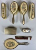 SILVER & NEEDLEPOINT SIX PIECE DRESSING TABLE SET including a hand mirror, rectangular silver backed