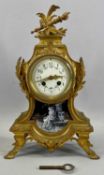 FRENCH GILDED BRONZE MANTEL CLOCK with circular enamel dial, decorated with flowers and with black