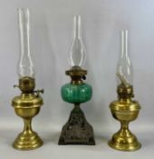 OIL LAMPS including Victorian oil lamp with pierced cast iron base, green clear glass reservoir