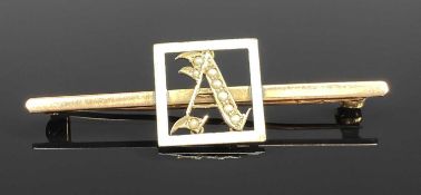 EDWARDIAN 9CT ROSE GOLD SEED PEARL AND ENAMEL DECORATED MONOGRAM 'A' BROOCH, 2.7gms Provenance: