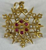 VICTORIAN 15CT GOLD GARNET & SPLIT SEED PEARL OPENWORK STAR BROOCH, 25mm (diam.), 5.1gms Provenance: