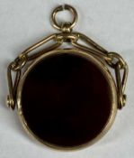CIRCULAR BLOOD STONE SWIVEL FOB in 9ct rose gold mount, 11gms gross Provenance: private collection