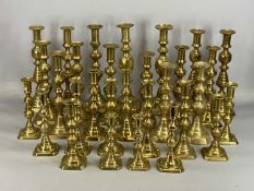 LARGE QUANTITY OF VICTORIAN BRASS CANDLESTICKS including 'The King of Diamonds', 31cms (h)