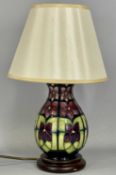 MOORCROFT TABLE LAMP with geometric floral pattern, on wooden base, 23cms (h) to fitting Provenance: