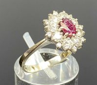 18CT WHITE GOLD RUBY & DIAMOND CLUSTER RING, central oval ruby with surround of claw set brilliant