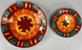 POOLE 'VOLCANO' SHALLOW CIRCULAR CHARGER, 41cms (diam.) and similar smaller, 26.5cms (diam.) (2)