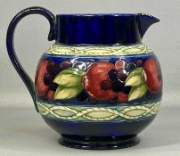 LARGE MOORCROFT POMEGRANATE PATTERN JUG with impressed marks and signature, 19cms (h) Provenance: