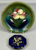 TWO MOORCROFT CERAMICS comprising green 'Freesia' circular dish, with impressed marks and signature,