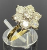 18CT YELLOW & WHITE GOLD DIAMOND CLUSTER RING, claw set with central round brilliant cut diamond,