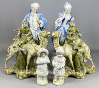 CONTINENTAL PORCELAIN FIGURINES consisting of a pair of figures and camels, 29cms (h), lady and
