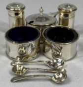 GEORGE V SILVER FIVE PIECE CRUET SET with blue glass liners and spoons in plush fitted case,