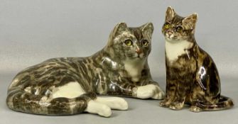 TWO WINSTANLEY POTTERY CATS, recumbent tabby cat, 37cms (l), and seated tabby kitten, 22cms (h)