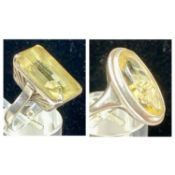 WHITE METAL & CITRINE DRESS RINGS, rectangular stone with engraved mount, size J, and oval stone,