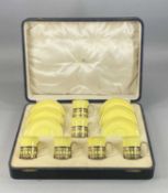 CASED SET OF SIX SHELLEY COFFEE CANS & SAUCERS, yellow glazed with pierced silver holders,