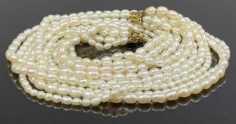 SIX STRAND CULTURED PEARL NECKLACE with ornate 9ct gold clasp, 47cms (l) Provenance: private
