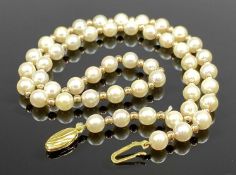 SINGLE STRAND NECKLACE OF 49 PEARLS, each spaced with gold bead, 9ct gold clasp, 46cms (l)