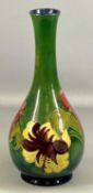 MOORCROFT GREEN HIBISCUS PATTERN TALL BOTTLE VASE with impressed marks, signature, and original