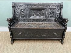 FLEMISH STAINED OAK BOX SETTLE, triple panel back carved with medieval figures and profile heads