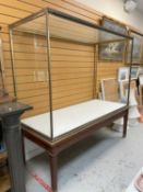 LARGE ANTIQUE BRASS FRAMED MUSEUM CABINET ON STAND, glazed on all sides with both large panes