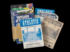 THE FOOTBALL CLUB HOUSE: WIGAN ATHLETIC PROGRAMMES FROM SEASONS 1977 - 2002, the earliest Wigan
