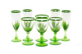 VERY LARGE SUITE OF GREEN GLASS STEMWARE, each hand painted with palm leaves on green stems,