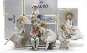 FIVE LLADRÓ FIGURINES including, Ten and Growing 7635, All Aboard 7619, Bunny Kisses 6741, Picture