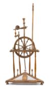 TREEN SPINNING WHEEL, possibly fruit wood/chestnut, incorporates 50 separate elements, the wheel