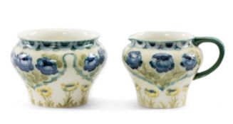 WILLIAM MOORCROFT FOR JAMES MACINTYRE & CO: FLORIAN MILK JUG & SUGAR BOWL, painted with poppies in