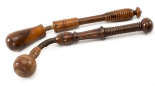 TWO TREEN LIFE PRESERVERS, the club joined to the handle with stitched leather, over rope, one in